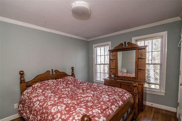 bedroom featuring dark hardwood / wood-style floors and crown molding