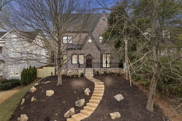 view of front of home with french doors and brick siding