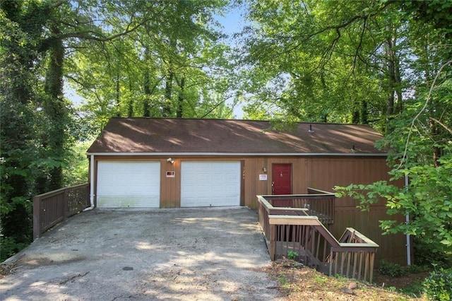 view of front of house with a garage and an outdoor structure