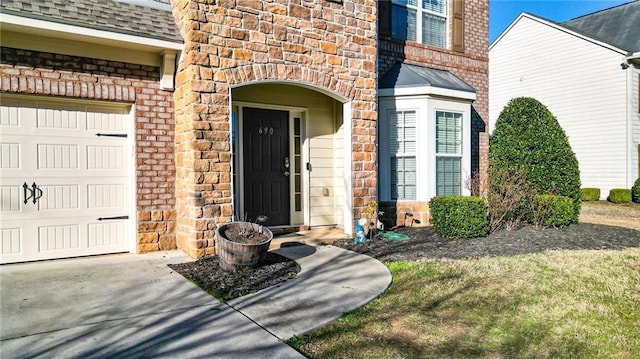 entrance to property featuring a garage