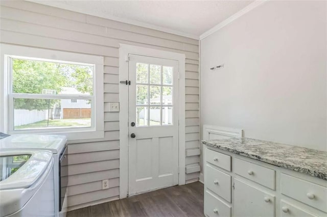 127 Rogers Ave, Macon, GA 31204 - doorway featuring crown molding, washer and dryer, dark wood-type flooring, and wooden walls