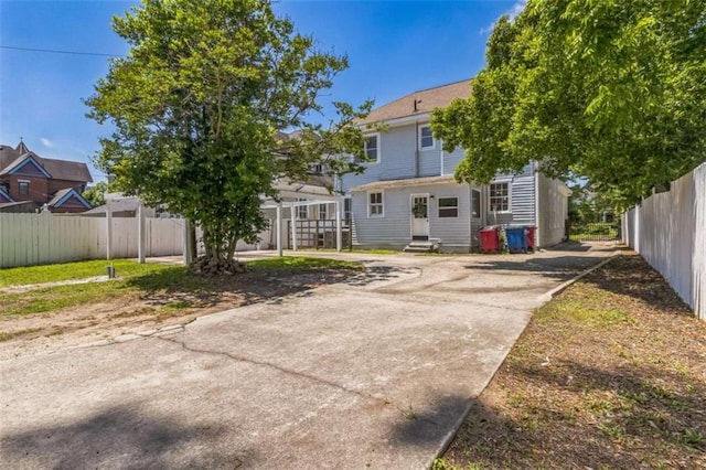 127 Rogers Ave, Macon, GA 31204 - back of property featuring concrete driveway and entry steps
