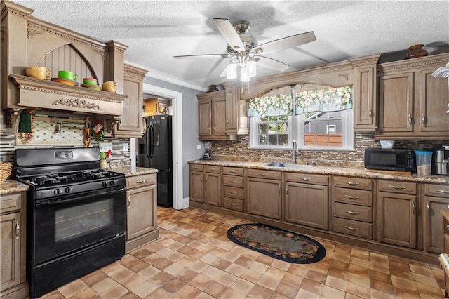 942 Hardwick Cir, Dalton, GA 30720 - kitchen featuring a textured ceiling, black appliances, tasteful backsplash, and a sink