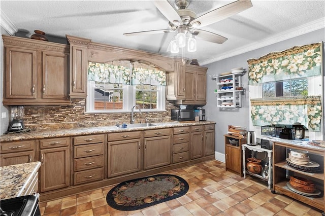 942 Hardwick Cir, Dalton, GA 30720 - kitchen with black microwave, a textured ceiling, a sink, backsplash, and crown molding