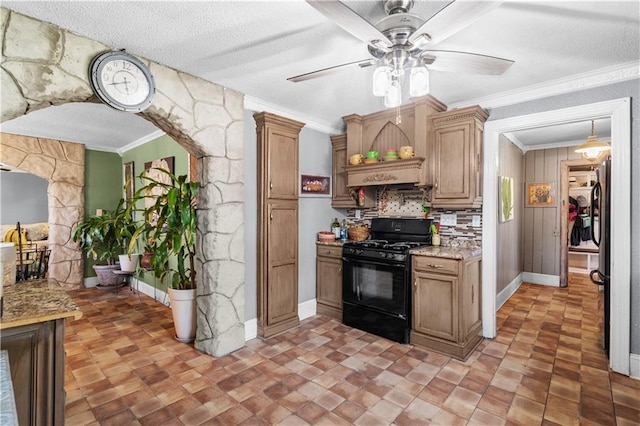 942 Hardwick Cir, Dalton, GA 30720 - kitchen featuring a textured ceiling, ornamental molding, black gas range, and light stone counters