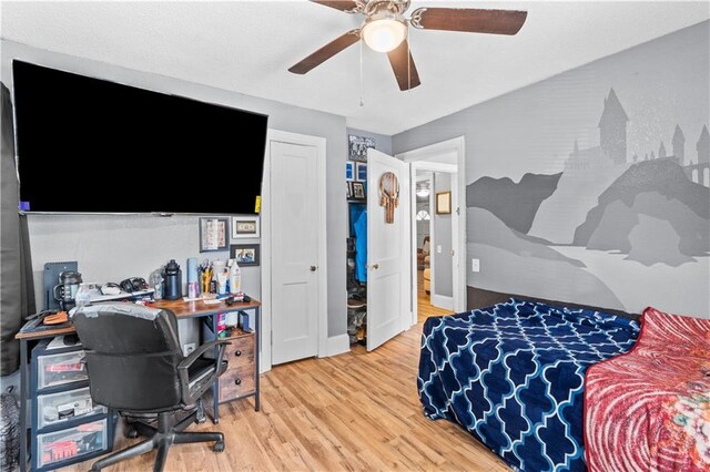 942 Hardwick Cir, Dalton, GA 30720 - bedroom with light wood-style floors, ceiling fan, and baseboards