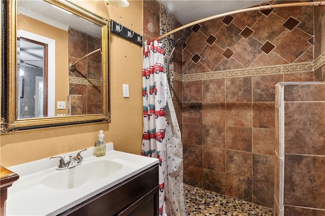 942 Hardwick Cir, Dalton, GA 30720 - bathroom with a textured wall, a shower stall, and vanity