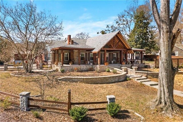 942 Hardwick Cir, Dalton, GA 30720 - rear view of property featuring a patio, a fenced front yard, and a chimney
