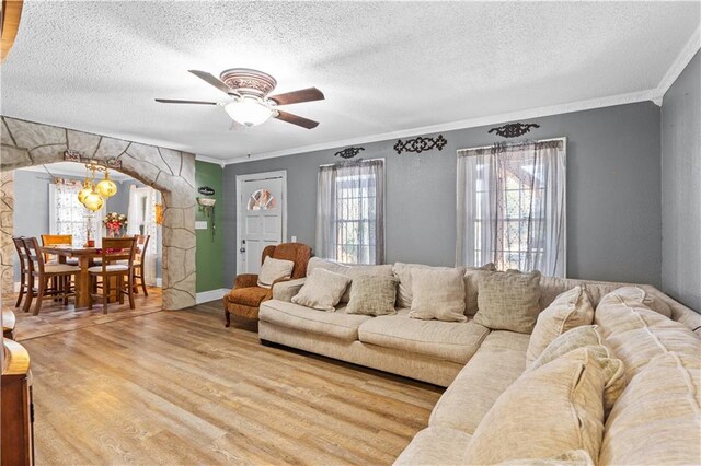 942 Hardwick Cir, Dalton, GA 30720 - living area with a textured ceiling, arched walkways, crown molding, and wood finished floors