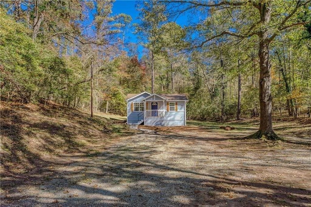 exterior space featuring a forest view