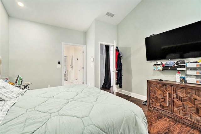 bedroom with baseboards, recessed lighting, wood finished floors, and visible vents
