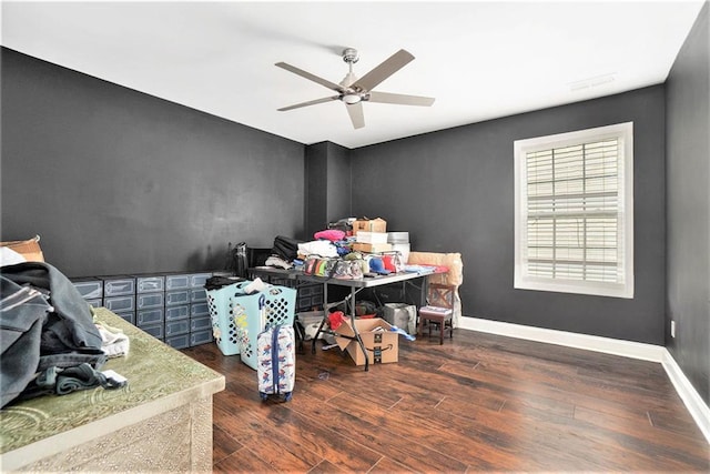 office area with baseboards, a ceiling fan, and wood finished floors