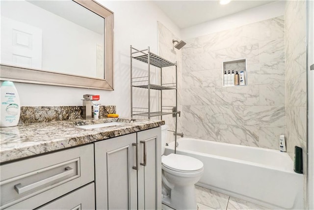 full bathroom with vanity, marble finish floor, shower / bathtub combination, and toilet