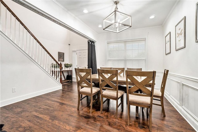 dining area featuring stairway, ornamental molding, dark wood-style floors, and a notable chandelier