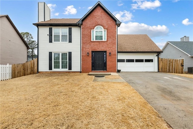 view of front of home with an attached garage, central AC, fence, driveway, and a chimney