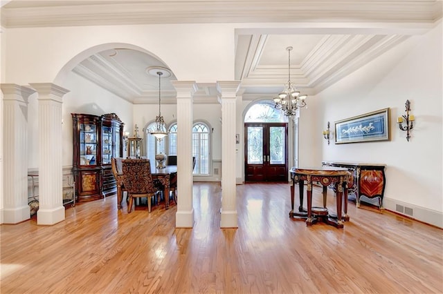 8455 Abingdon Ln, Duluth, GA 30097 - foyer with ornamental molding, light wood-type flooring, french doors, arched walkways, and a chandelier