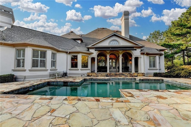 8455 Abingdon Ln, Duluth, GA 30097 - back of property featuring a patio, an outdoor pool, stucco siding, and a chimney
