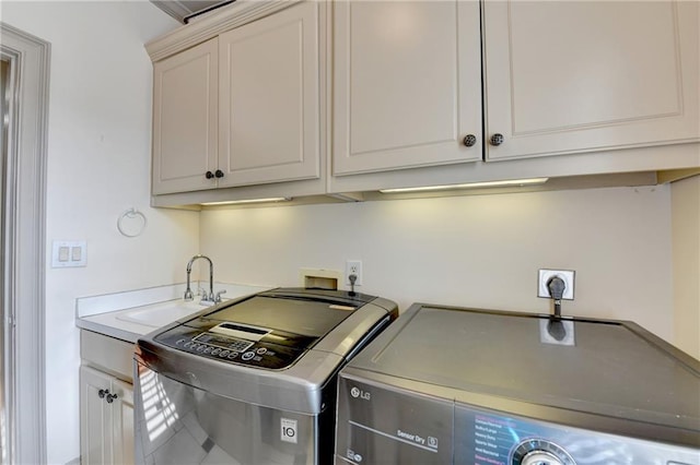 8455 Abingdon Ln, Duluth, GA 30097 - washroom featuring washing machine and clothes dryer and cabinet space