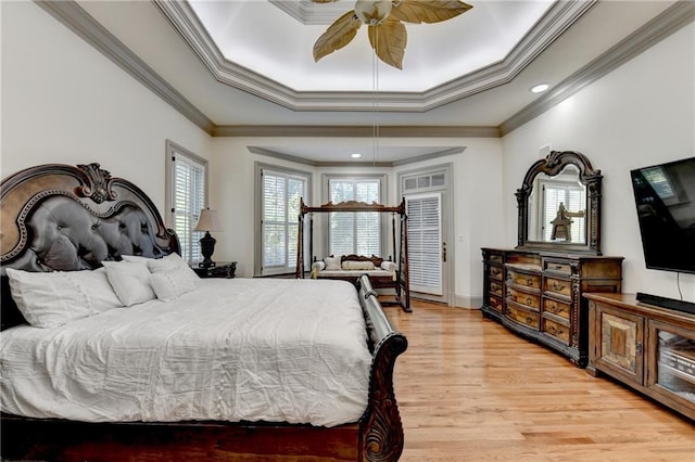 8455 Abingdon Ln, Duluth, GA 30097 - bedroom featuring ornamental molding, light wood-style floors, recessed lighting, a tray ceiling, and ceiling fan
