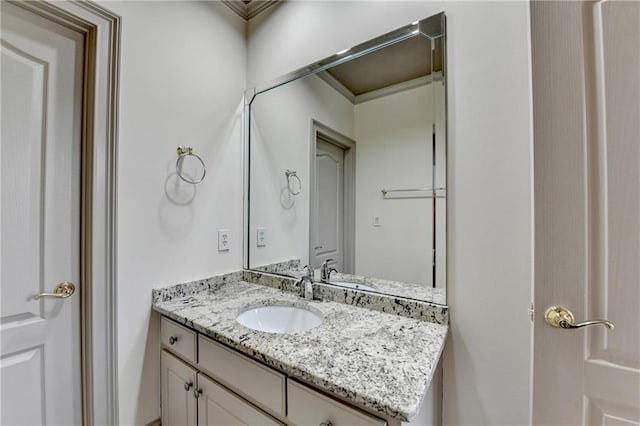 8455 Abingdon Ln, Duluth, GA 30097 - bathroom featuring vanity and ornamental molding