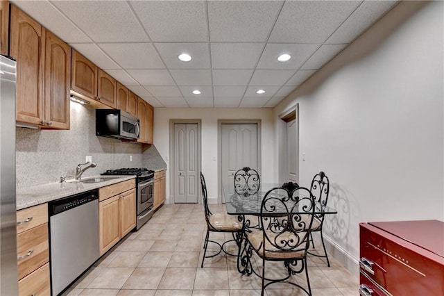 8455 Abingdon Ln, Duluth, GA 30097 - kitchen with stainless steel appliances, recessed lighting, light countertops, light tile patterned flooring, and a drop ceiling