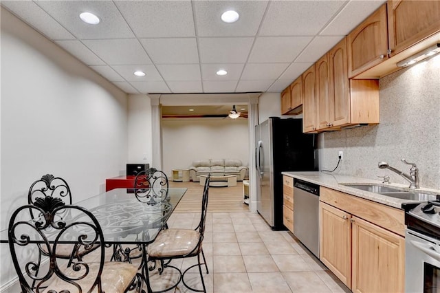 8455 Abingdon Ln, Duluth, GA 30097 - kitchen with stainless steel appliances, light tile patterned flooring, recessed lighting, a ceiling fan, and light stone countertops