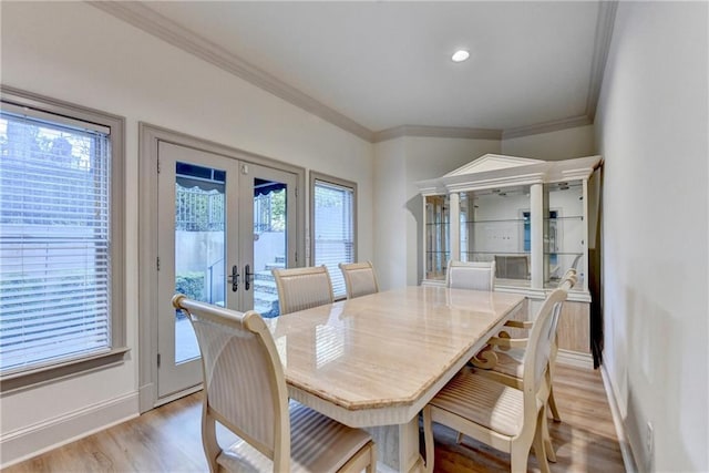 8455 Abingdon Ln, Duluth, GA 30097 - dining room featuring french doors, light wood finished floors, and ornamental molding