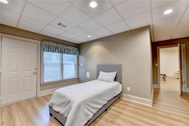 8455 Abingdon Ln, Duluth, GA 30097 - bedroom with light wood-style floors and a drop ceiling