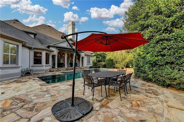 8455 Abingdon Ln, Duluth, GA 30097 - view of patio / terrace with an outdoor pool and outdoor dining space