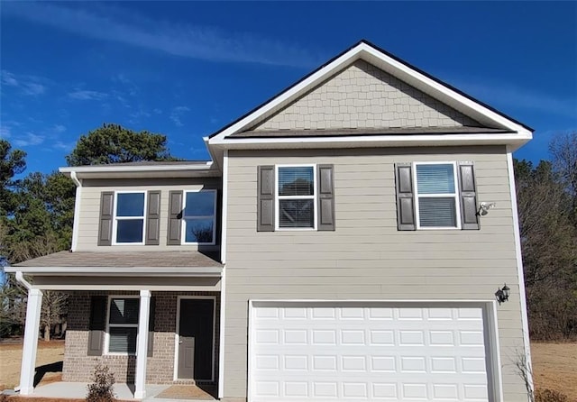 view of front of home with a garage and covered porch