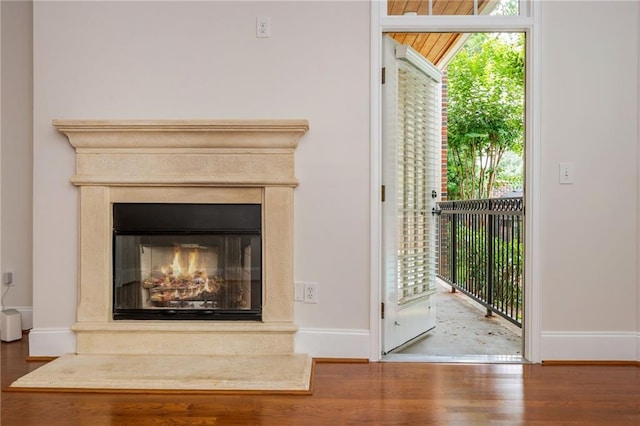 825 Highland Ln NE Unit 1116, Atlanta, GA 30306 - detailed view of wood finished floors and a premium fireplace