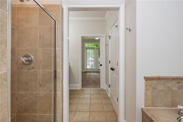 825 Highland Ln NE Unit 1116, Atlanta, GA 30306 - bathroom featuring a stall shower, ornamental molding, and tile patterned floors
