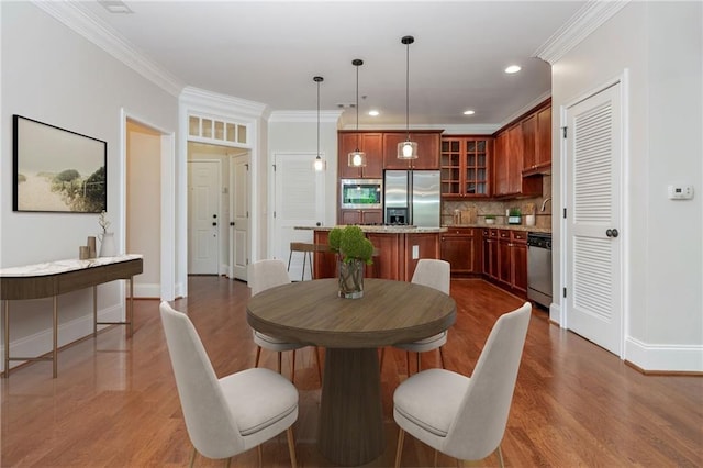 825 Highland Ln NE Unit 1116, Atlanta, GA 30306 - dining space with dark wood-style flooring, crown molding, and recessed lighting
