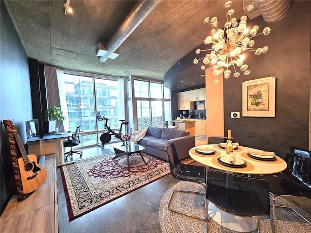 living room with expansive windows and an inviting chandelier