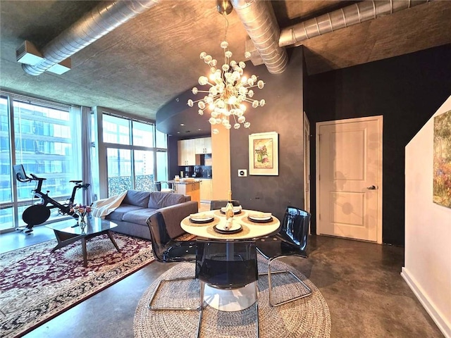 dining area with an inviting chandelier