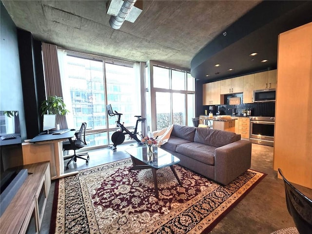 living room with expansive windows and a wealth of natural light