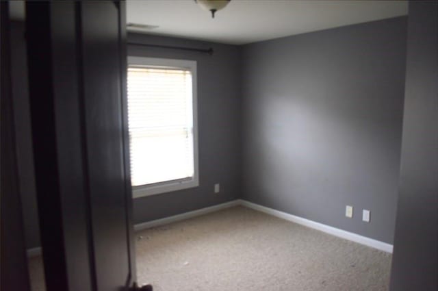 spare room with carpet floors