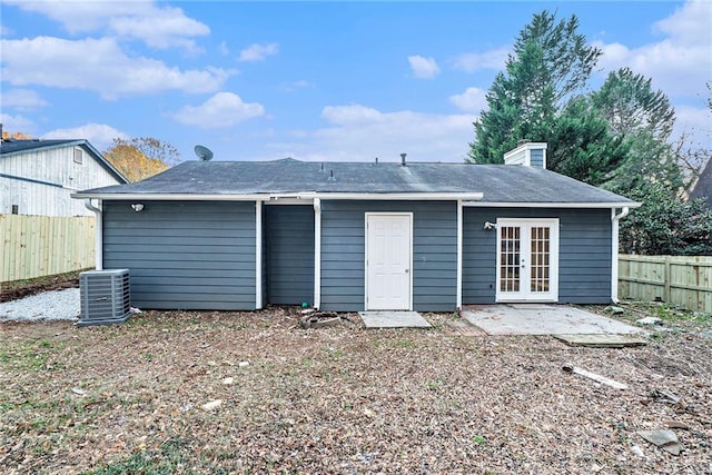 back of house featuring french doors, central AC, and a patio area