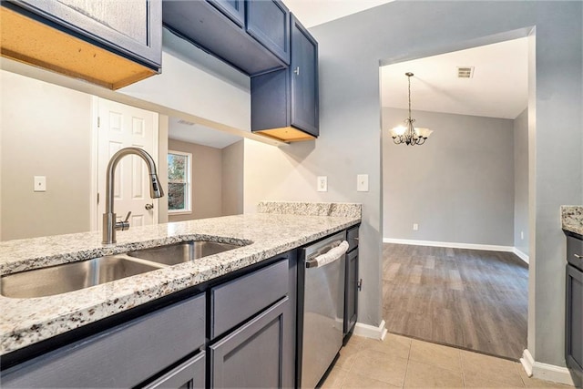 kitchen with stainless steel dishwasher, light stone countertops, sink, and light hardwood / wood-style flooring