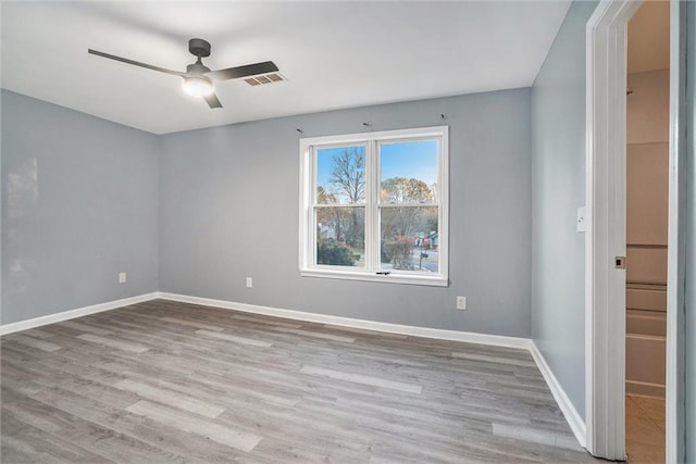 unfurnished room featuring ceiling fan and light hardwood / wood-style flooring