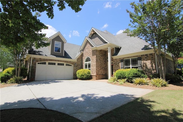1520 Camden Cove Dr, Cumming, GA 30040 - view of front of property featuring driveway, brick siding, and roof with shingles