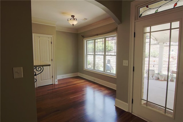1520 Camden Cove Dr, Cumming, GA 30040 - foyer entrance with arched walkways, dark wood finished floors, baseboards, and crown molding