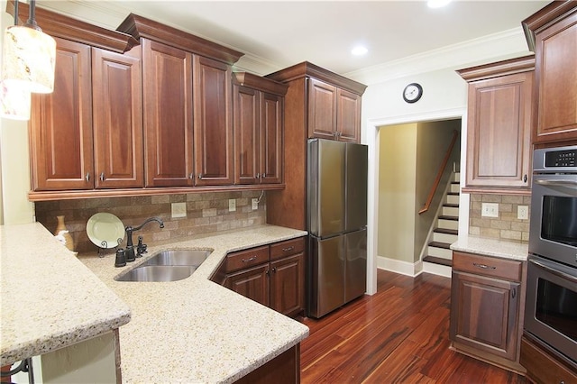 1520 Camden Cove Dr, Cumming, GA 30040 - kitchen featuring appliances with stainless steel finishes, a sink, baseboards, dark wood finished floors, and backsplash
