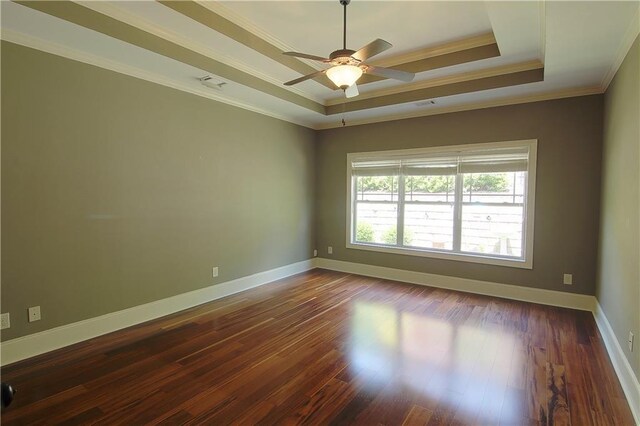 1520 Camden Cove Dr, Cumming, GA 30040 - unfurnished room featuring a tray ceiling, crown molding, a ceiling fan, dark wood-style floors, and baseboards