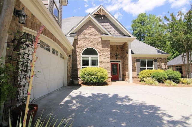 1520 Camden Cove Dr, Cumming, GA 30040 - craftsman inspired home featuring driveway, stone siding, and roof with shingles