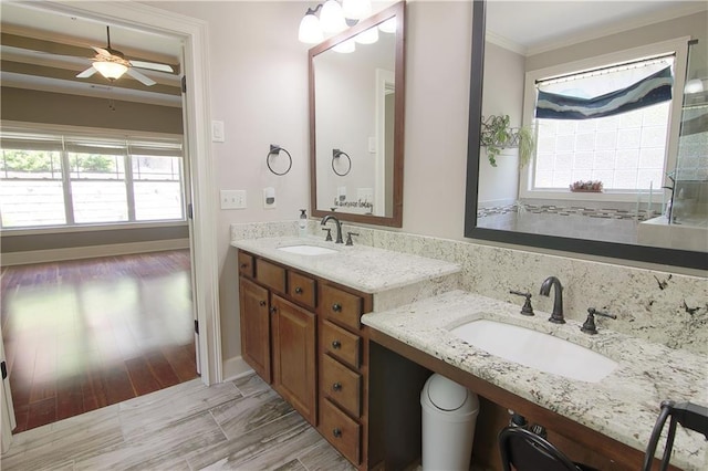 1520 Camden Cove Dr, Cumming, GA 30040 - bathroom featuring ornamental molding, plenty of natural light, a ceiling fan, and vanity
