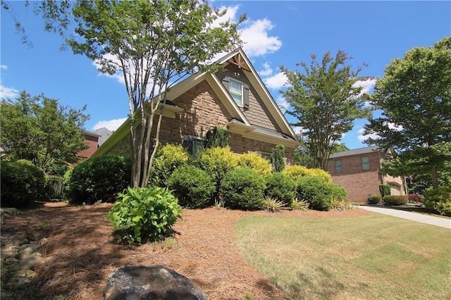 1520 Camden Cove Dr, Cumming, GA 30040 - view of side of property with stone siding and a lawn