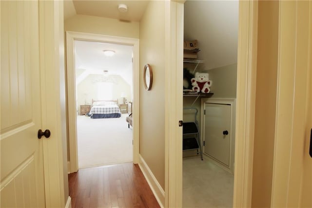 1520 Camden Cove Dr, Cumming, GA 30040 - hallway featuring lofted ceiling, wood finished floors, and carpet floors