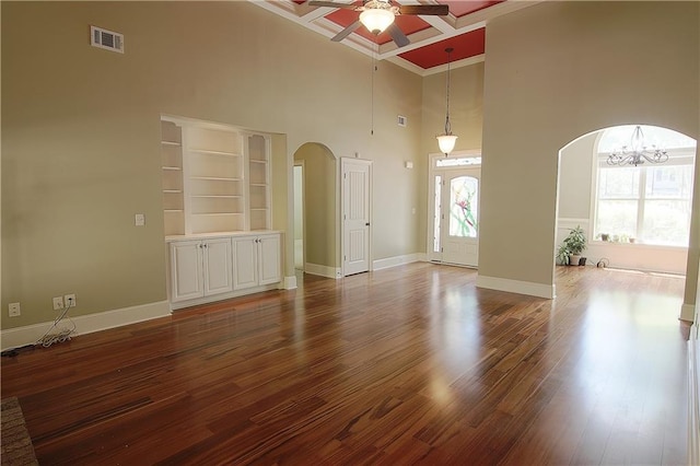 1520 Camden Cove Dr, Cumming, GA 30040 - unfurnished room featuring arched walkways, a high ceiling, ceiling fan, a chandelier, and baseboards