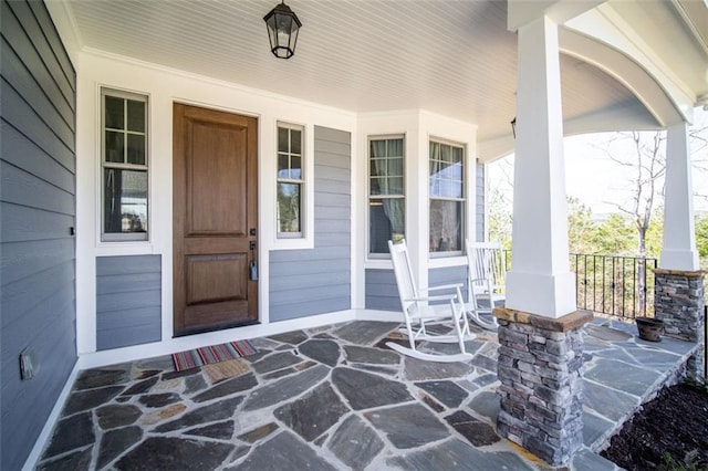 property entrance featuring covered porch